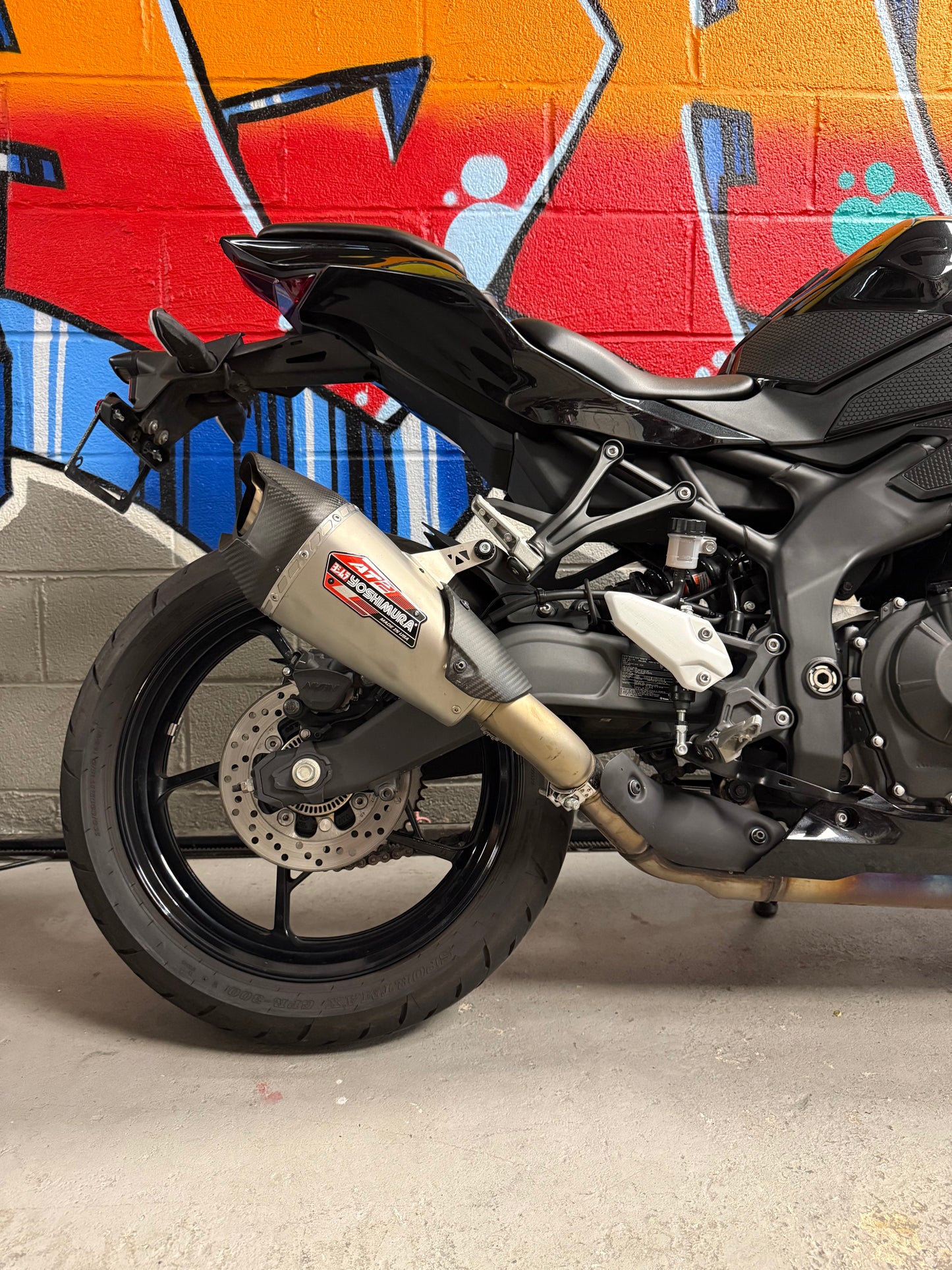 2024 Kawasaki Ninja ZX4R in Metallic Spark Black Yoshi AT2